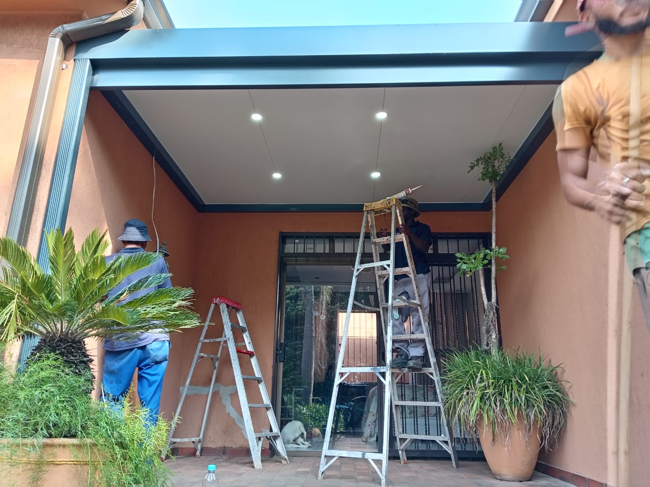 Insulated patio ceiling with downlights