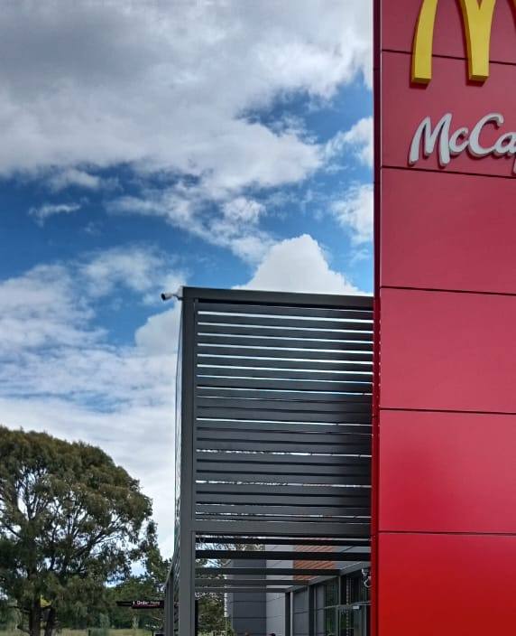 Aluminium blade screening wrapping the entrance tower at McDonald's Bethlehem